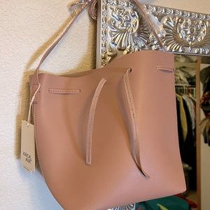 Dusty pink colored vegan leather bucket purse by Kayla + Ava.
